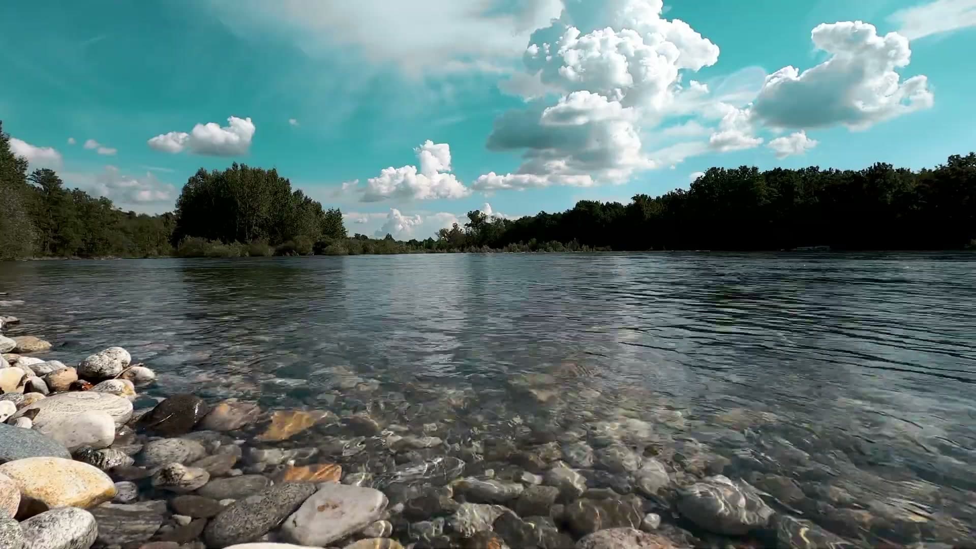 Clear river water over smooth rocks in New England.