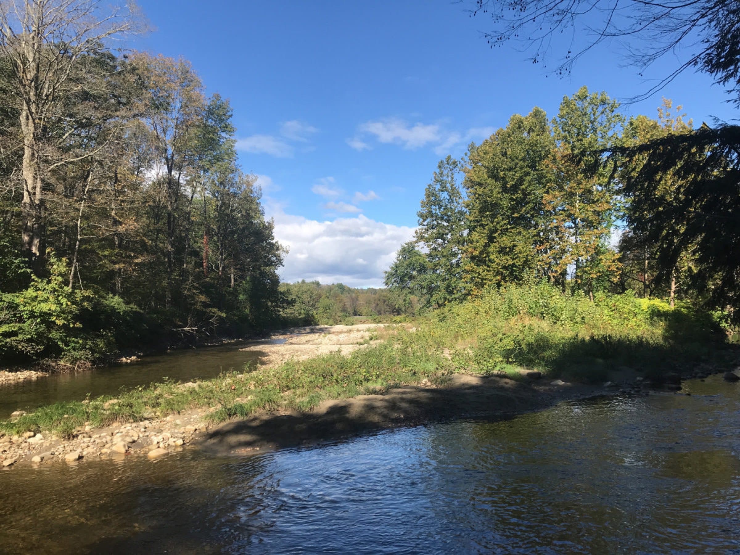 Williams River current and broad gravel bars at Rainbow Rock Swimming Hole in Chester, Vermont.