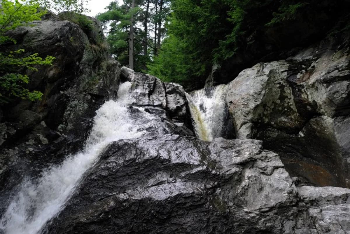 Bolton Potholes gorge in Vermont with clear brook pools and shaded rock ledges.