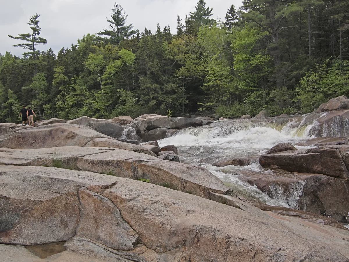 Lower Falls on the Swift River with clear White Mountains water and granite ledges.