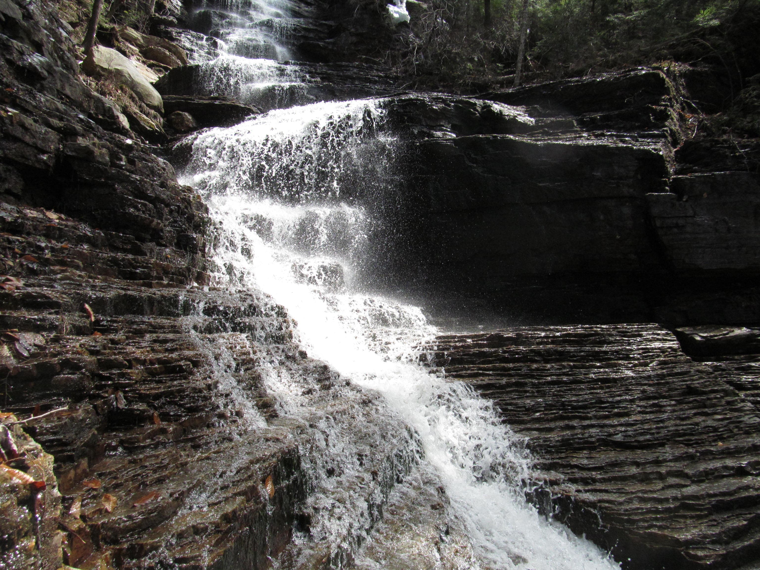 Main cascade at Lye Brook Falls near Manchester, Vermont, dropping over layered dark rock in spring flow.