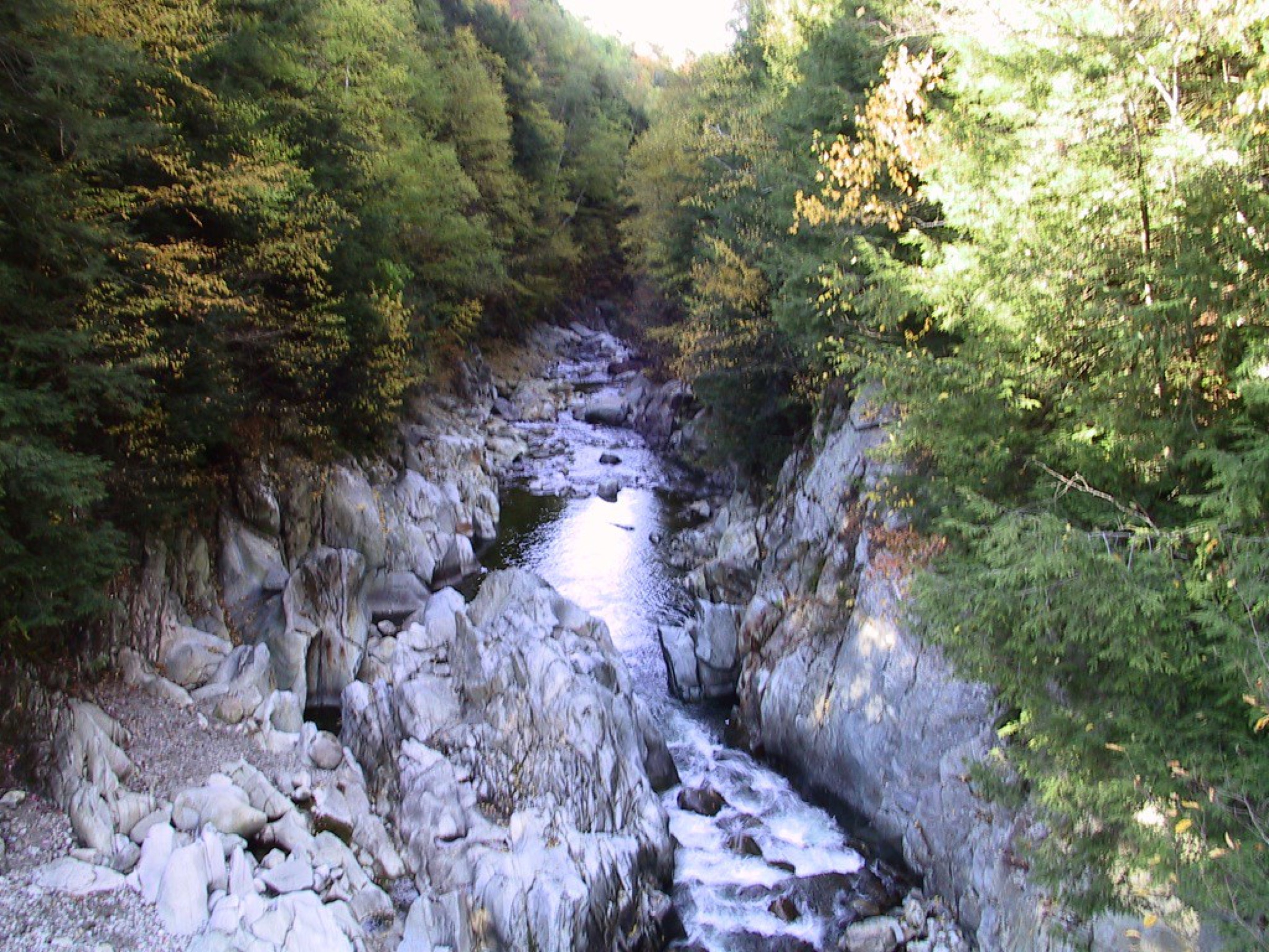 Kayakers in the steep rock channel at Clarendon Gorge on the Mill River in Clarendon, Vermont.