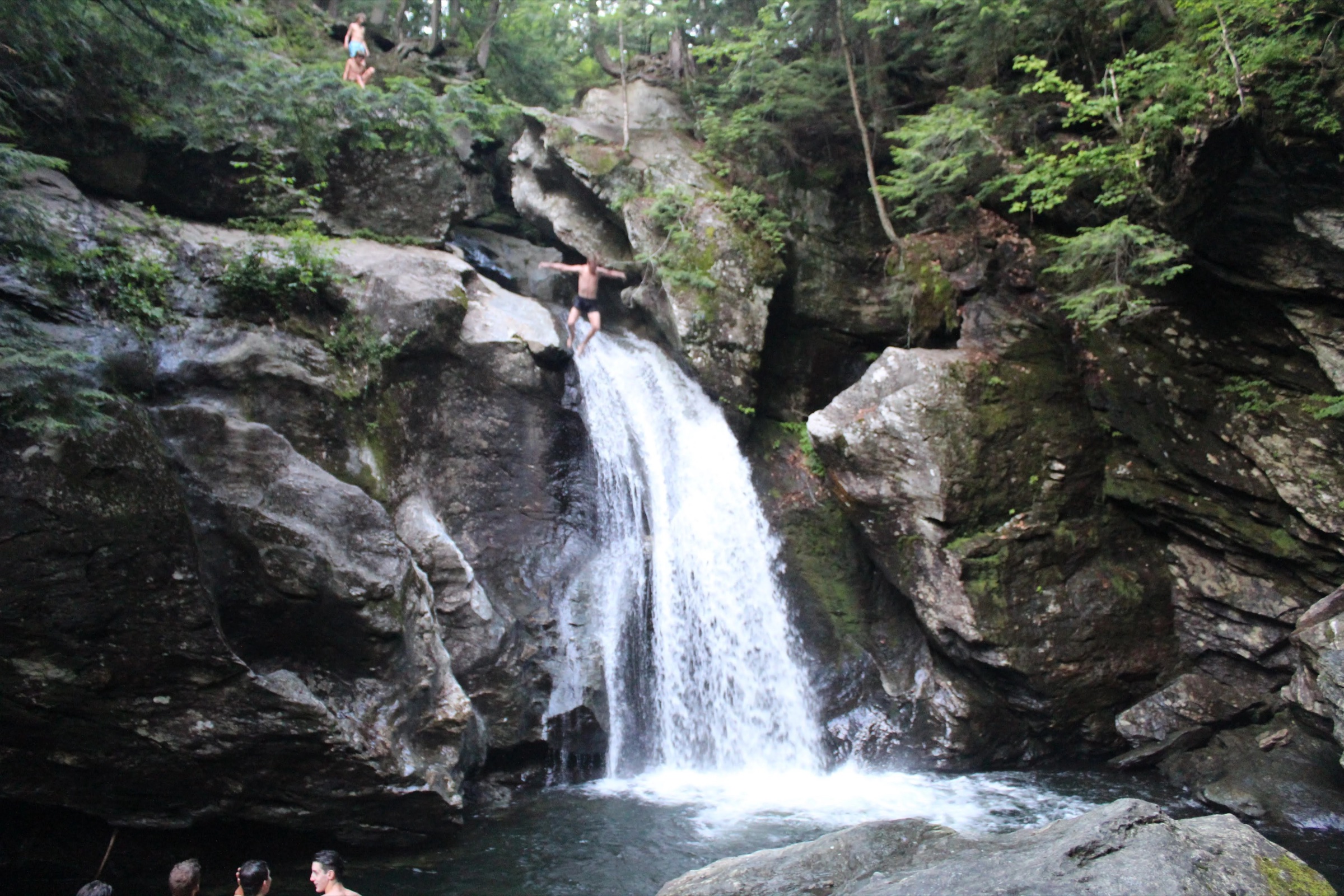 Deep green pool and smooth river rocks at Foster’s Hole on Notch Brook in Stowe, Vermont.